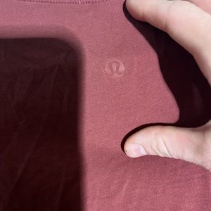 size 4 burgundy lululemon cropped t shirt worn a few times!